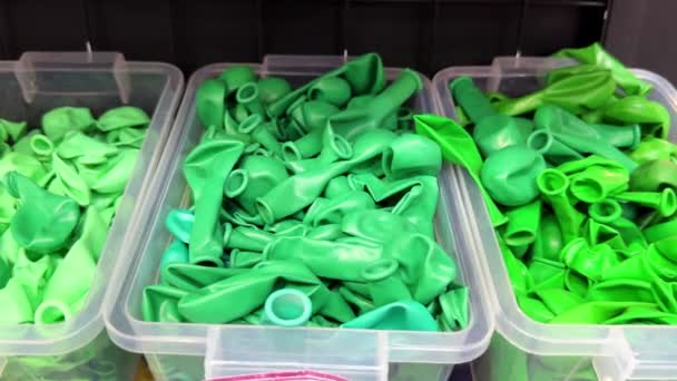 Many Colorful Balloons Deflated Plastic Box Shelf Store Holiday Events — Stock Video