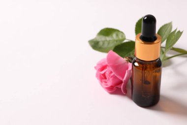 bottle with pipette, serum, pipette on a pink background. natural cosmetics.