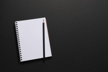 blank notepad on a black background