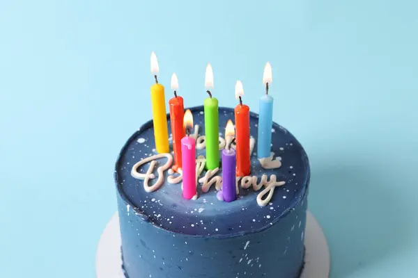 birthday cake with burning candle, top view