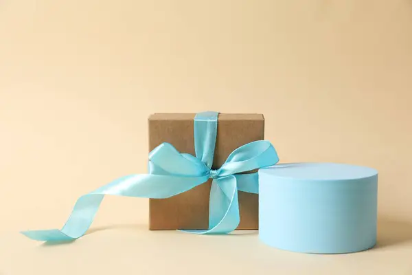 blue and white gift box with a white ribbon on a white background.