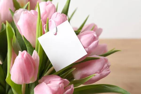 Beautiful bouquet of tulip flowers with a card, close up