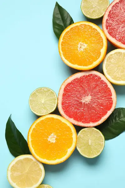 Summer tropical composition. Tropical fruits on a colored background. Summer concept. Flat lay, top view, copy space