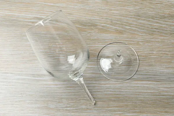 Glass of wine broken on the table