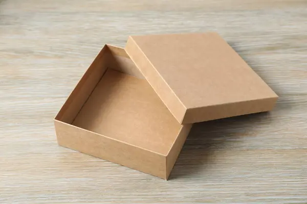 Open box on wooden background