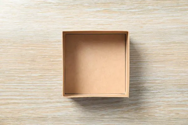 Open box on wooden background