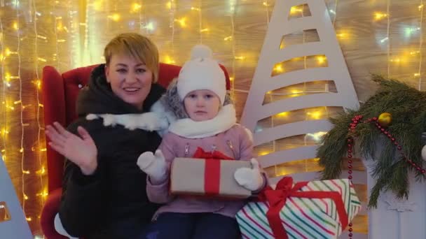 Joyous Mom Little Girl Holding Gift Boxes Smiling Waving Camera — Stockvideo