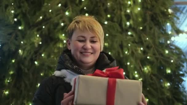 Happy Excited Woman Gives Christmas Box Red Ribbon Xmas Eve — Stock Video