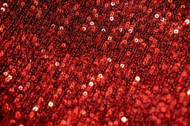 Kırmızı pulları kapat arka plan veya doku. Parlak pullu tekstil