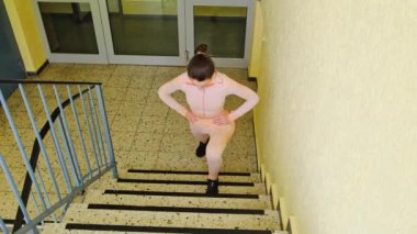 Stretching sports stairs emergency multi-storey building athlete girl.Healthy, wellness lifestyle. Sport and cardio workout concept.