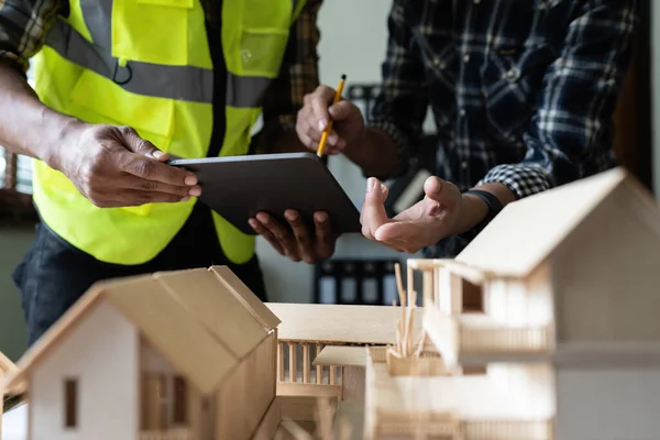 stock image Architect man working with blueprints for architectural plan, engineer sketching a construction project concept.