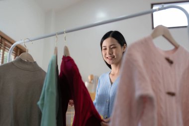 Young person using credit card and laptop computer. Online shopping, e-commerce concept.