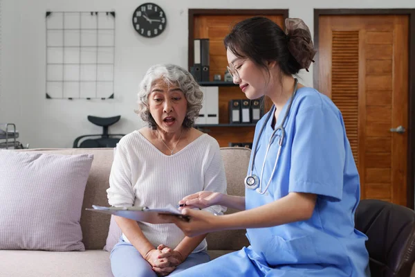 Asian youthful nurse caring for patients or the elderly at home. nursing at home concept.