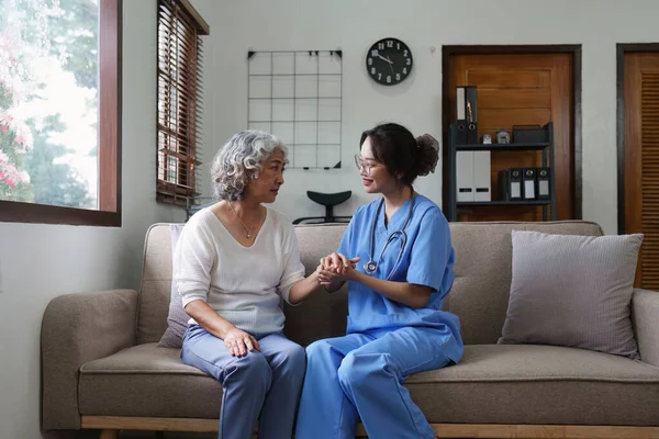 Asian youthful nurse caring for patients or the elderly at home. nursing at home concept.