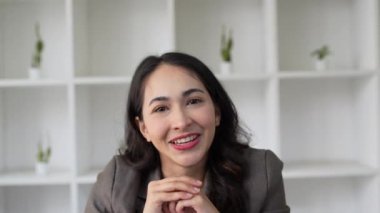 Attractive asian businesswoman using laptop video conference call, business colleagues. Communicating with team. High quality 4k footage