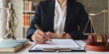 Close up of business lawyers working with agreement contract in office. Law, legal services, advice, Justice concept.