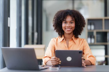 Accountant black woman working on laptop and do document, tax, exchange, accounting and Financial advisor concept.