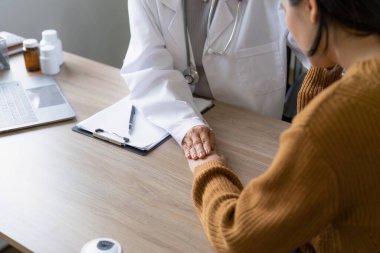 Doctor and patient are discussing at clinic. Digital healthcare and network connection, Data analysis concept.