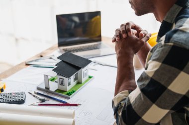Group of professional engineering people brainstorming at meeting and discussion in new project for modern house. architectural plan, engineer sketching a construction project, green energy concept