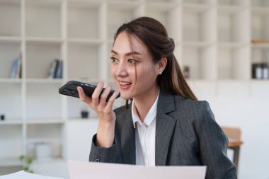 Beautiful business woman talking on the mobile phone. Management, planning and networking phone call concept