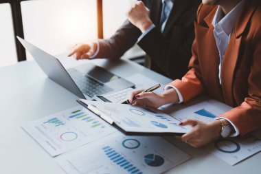 Business People Meeting Research finance report by laptop. management strategy analysis financial accounting concept.