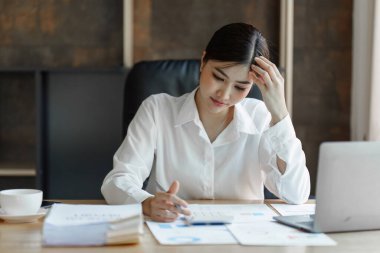 Tired business woman in stress works with many paperwork document. migraine attack. Freelance, work from home.