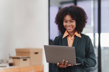 Accountant black woman working on laptop and do document, tax, exchange, accounting and Financial advisor concept.