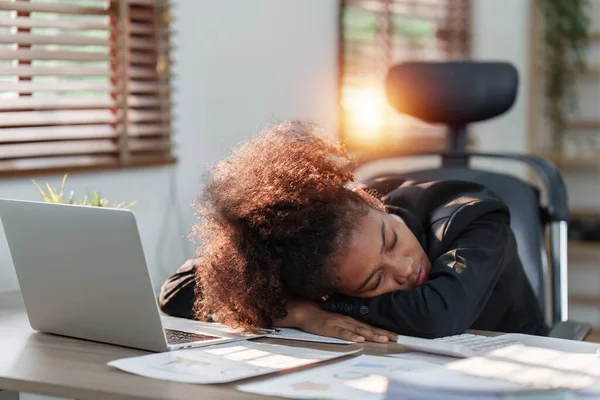stock image Tired American African business woman in stress works with many paperwork document. migraine attack. Freelance, work from home.