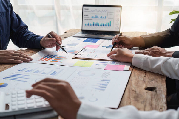 Business People Meeting to analysis the financial report paperwork in office. Financial advisor teamwork and accounting concept..