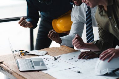 Foreman or Civil engineer put their hand to working together. industry professional team and engineer concept.