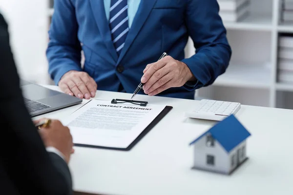 stock image Close up Business people or Real Estate agent explain signing agreement for sale house to client. Property, Insurance, Broker concept.