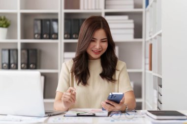 Beautiful Businesswoman completes KYC using an online banking program in order to open a digital savings account. The definition of cyber security.