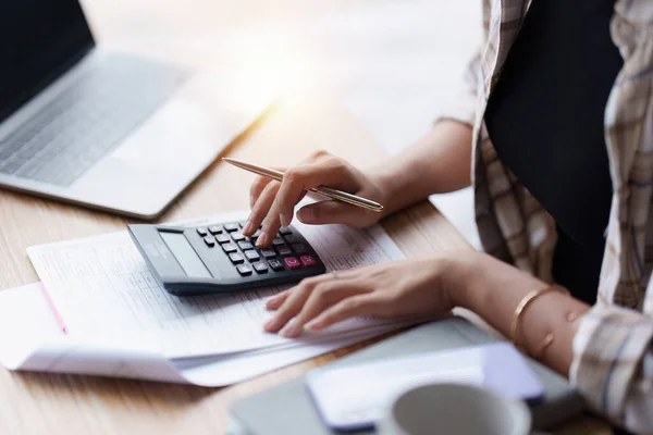 stock image Asian accounting professional calculating household bills, reviewing and analyzing household bills, and filing tax returns..