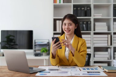 Beautiful Businesswoman completes KYC using an online banking program in order to open a digital savings account. The definition of cyber security.