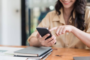 Beautiful Businesswoman completes KYC using an online banking program in order to open a digital savings account. The definition of cyber security.