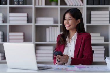 Beautiful Businesswoman completes KYC using an online banking program in order to open a digital savings account. The definition of cyber security.