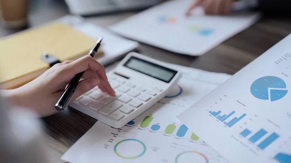 stock image Teamwork of business people discuss and use calculator for finance paperwork data in office.