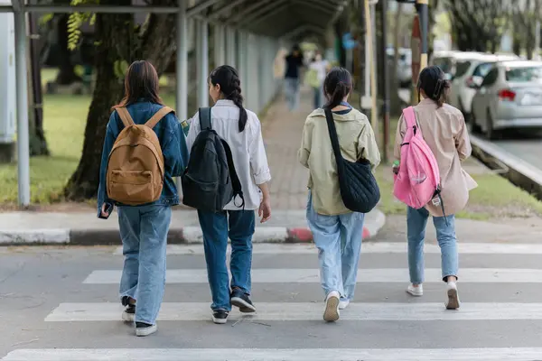 Group of Young Asian student walking and talking at university before class room. education, back to school concept.