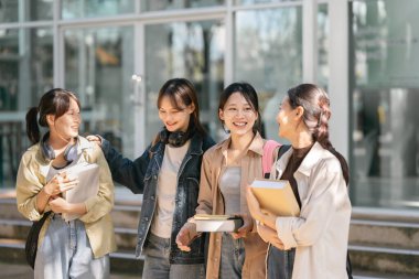 Group of Young Asian student walking and talking at university before class room. education, back to school concept.