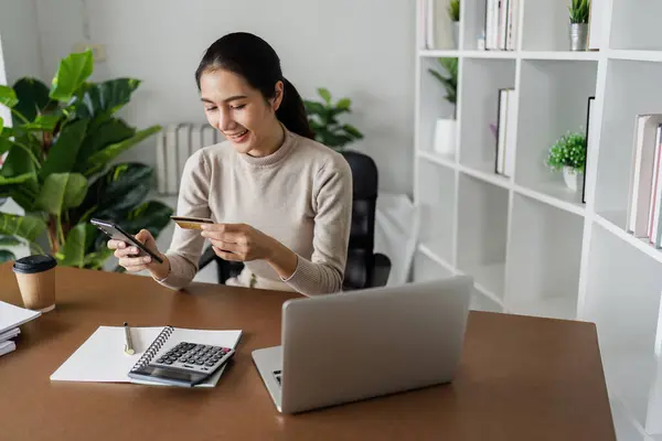 stock image Woman on desk with smartphone, credit card and ecommerce payment for online shopping at home.