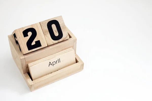 stock image Wooden perpetual calendar showing the 20th of April