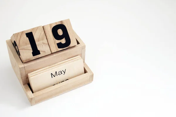 stock image Wooden perpetual calendar showing the 19th of May