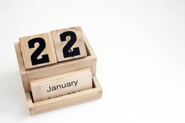 22 Ocak 'ı gösteren ahşap takvim.