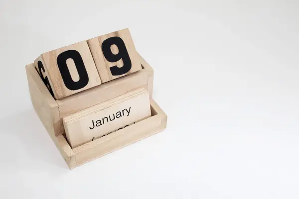 stock image Wooden perpetual calendar showing the 9th of January