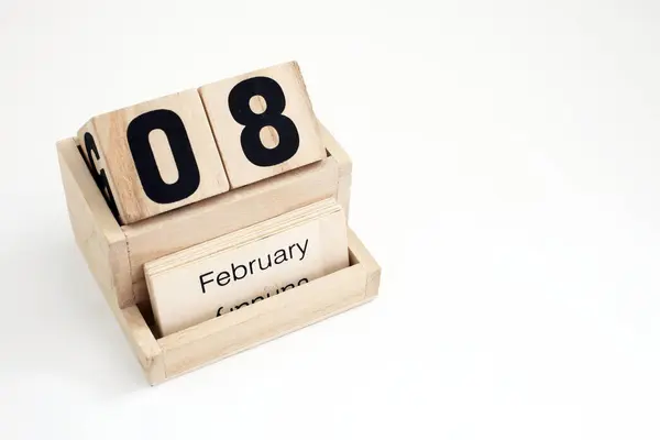 stock image Wooden perpetual calendar showing the 8th of February