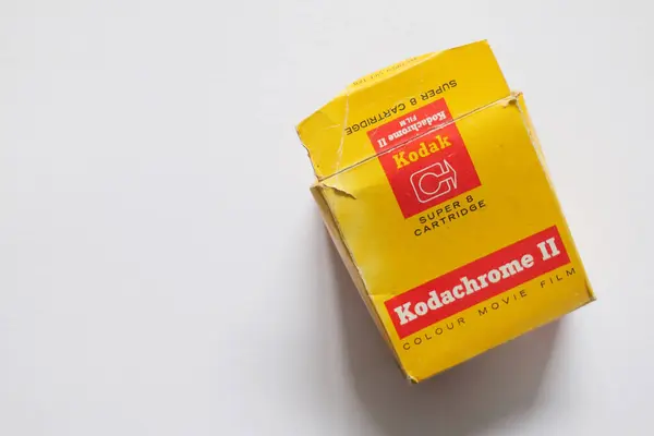 stock image Bradford, UK 09 25 2024 A close-up of an expired Kodak Kodachrome II Super 8 film cartridge, still sealed in its iconic yellow envelope with bold red Kodak branding.