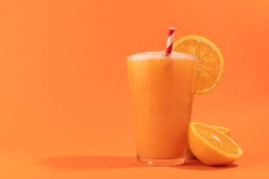 Orange juice isolated on orange background