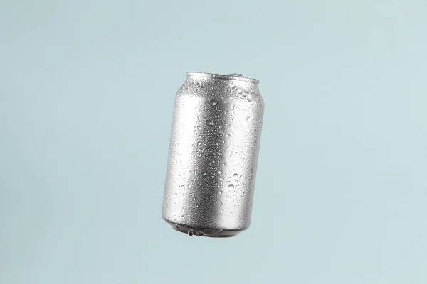 Aluminium beer or soda drinking can isolated on cyan