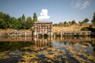 Eflatun Spring is a sacred water monument built during the Hittite Period. The monument depicts the gods who carry the sky and establish a connection between the earth and the sky. clipart