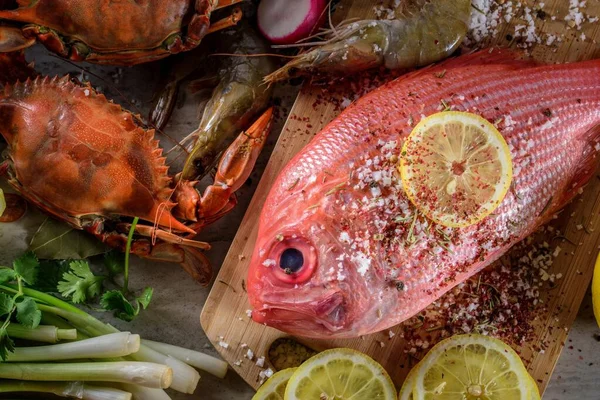 Exquisite Delights: Fresh New Zealand Red Snapper fish and Crab Infused with Salt, Spices, and Zesty Lemon in 4K